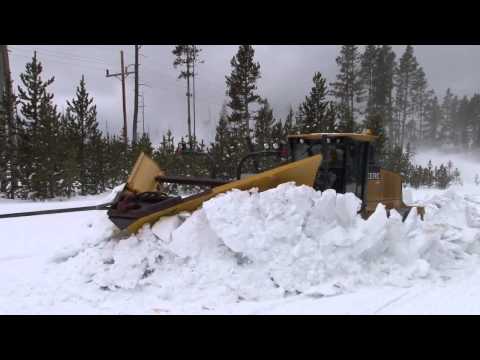 Plowing snow from roads in the spring in Yellowstone National Park
