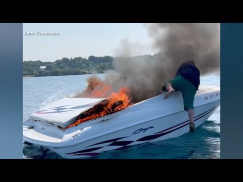&#039;It&#039;s gonna blow&#039;: Video captures dramatic moment family rescues 2 from boat engulfed in flames