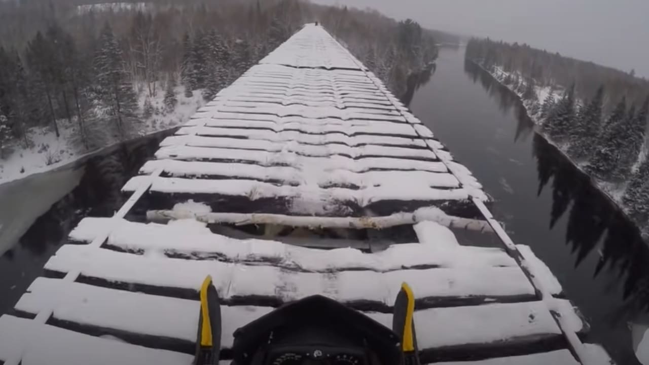 Sketchy abandoned railroad bridge snowmobile crossing