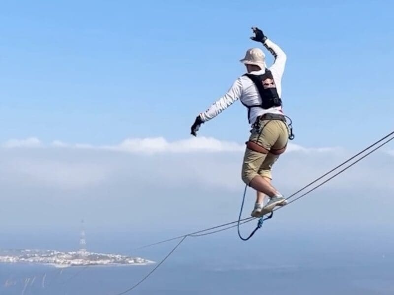 Jaan Roost crosses from mainland Italy to Sicily on a slackline.