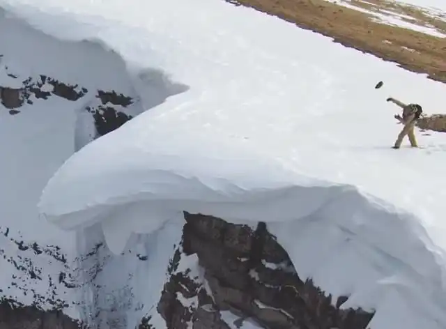 Enormous Overhanging Cornice Released By Simply Throwing Rocks