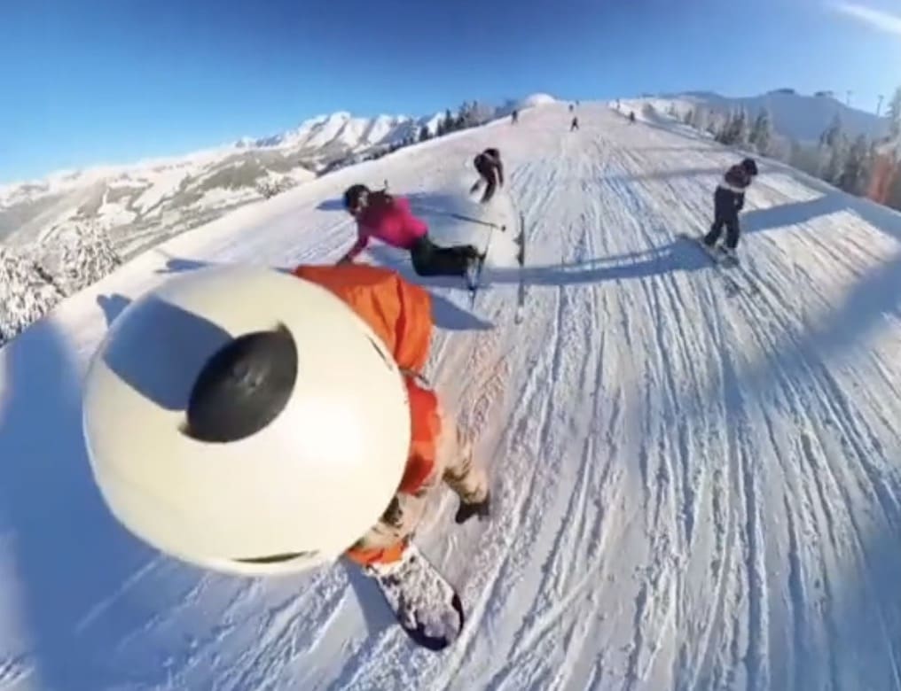Skier barrels into snowboard lesson.