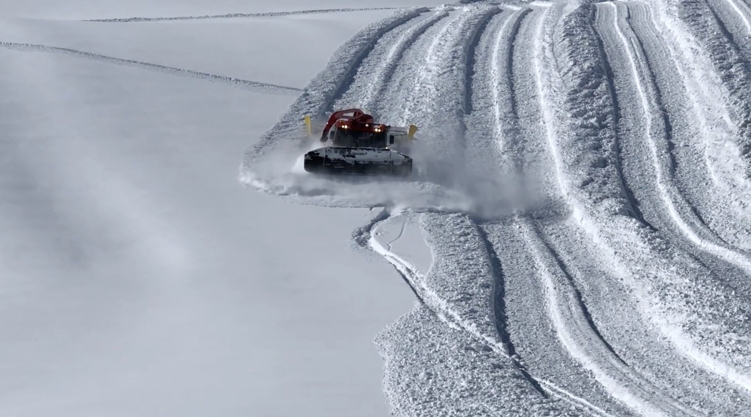 Snowcat Driver Surfs Fresh Powder At Swiss Ski Resort