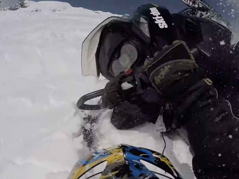 Snowmobiler caught and carried in avalanche.