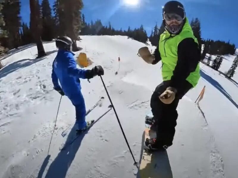 Ski Instructor hits passing snowboarder.