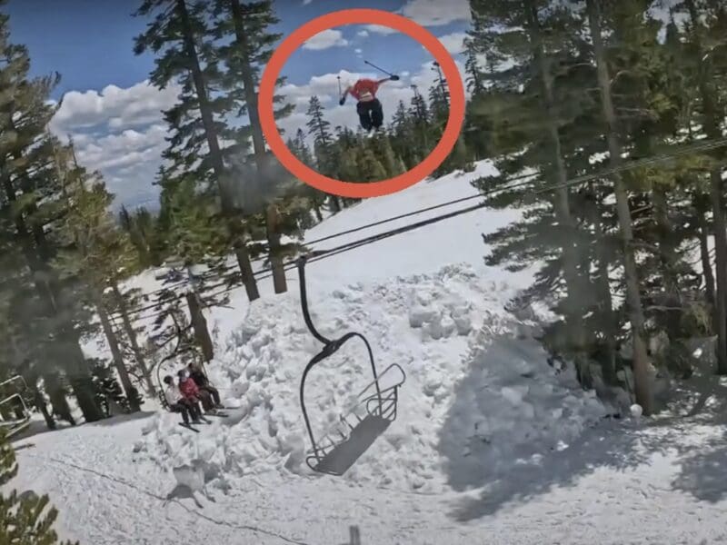 Skiers jump over chairlift at California's Mammoth Mountain Resort.