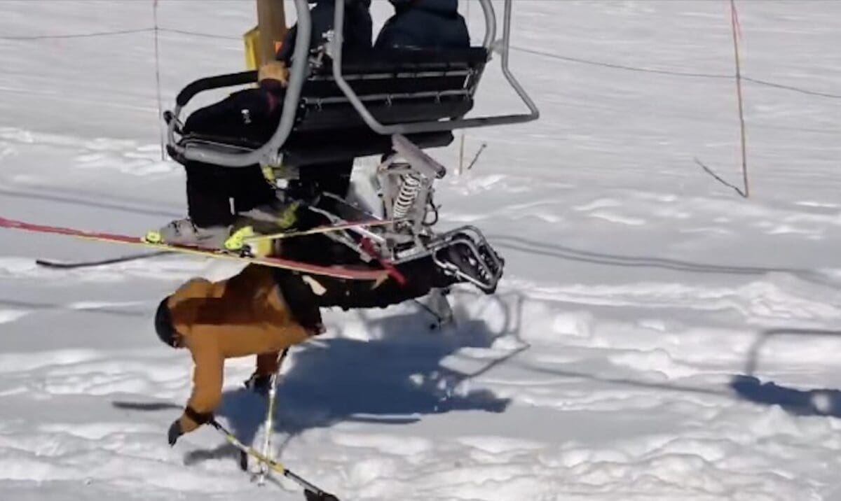 Vincent Barnard falls off the chairlift while sit-skiing.