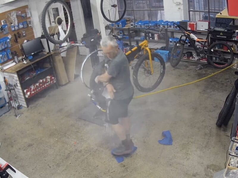 Overinflating a tubeless bike tire.