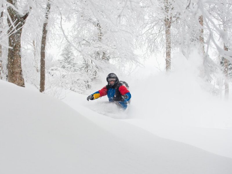 Snowboarder in deep snow in Jay Peak