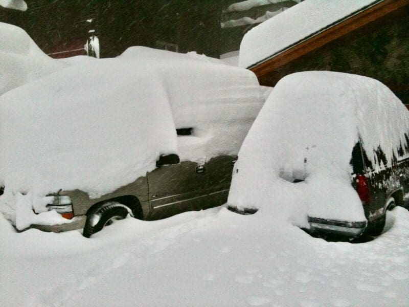 Two Tahoes trucks buried in snow in snow