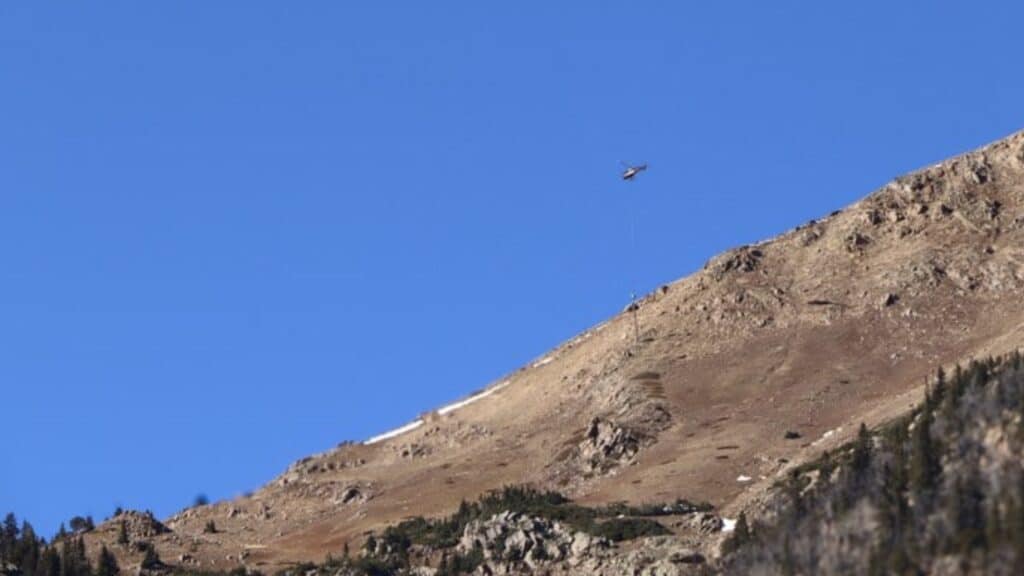 Helicopter loads charges into the new Wyssen avalanche equipment on the east side of the Eisenhower Johnson Memorial Tunnels.