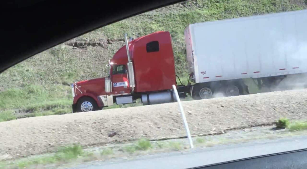 Semi-truck uses runaway truck ramp.