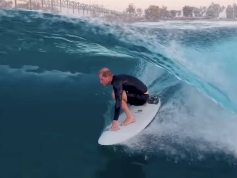 Prince Harry surfs a barrel