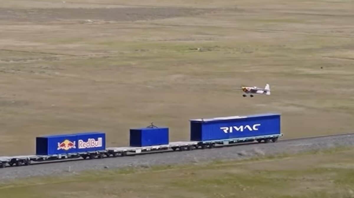 Landing a plane on a train.