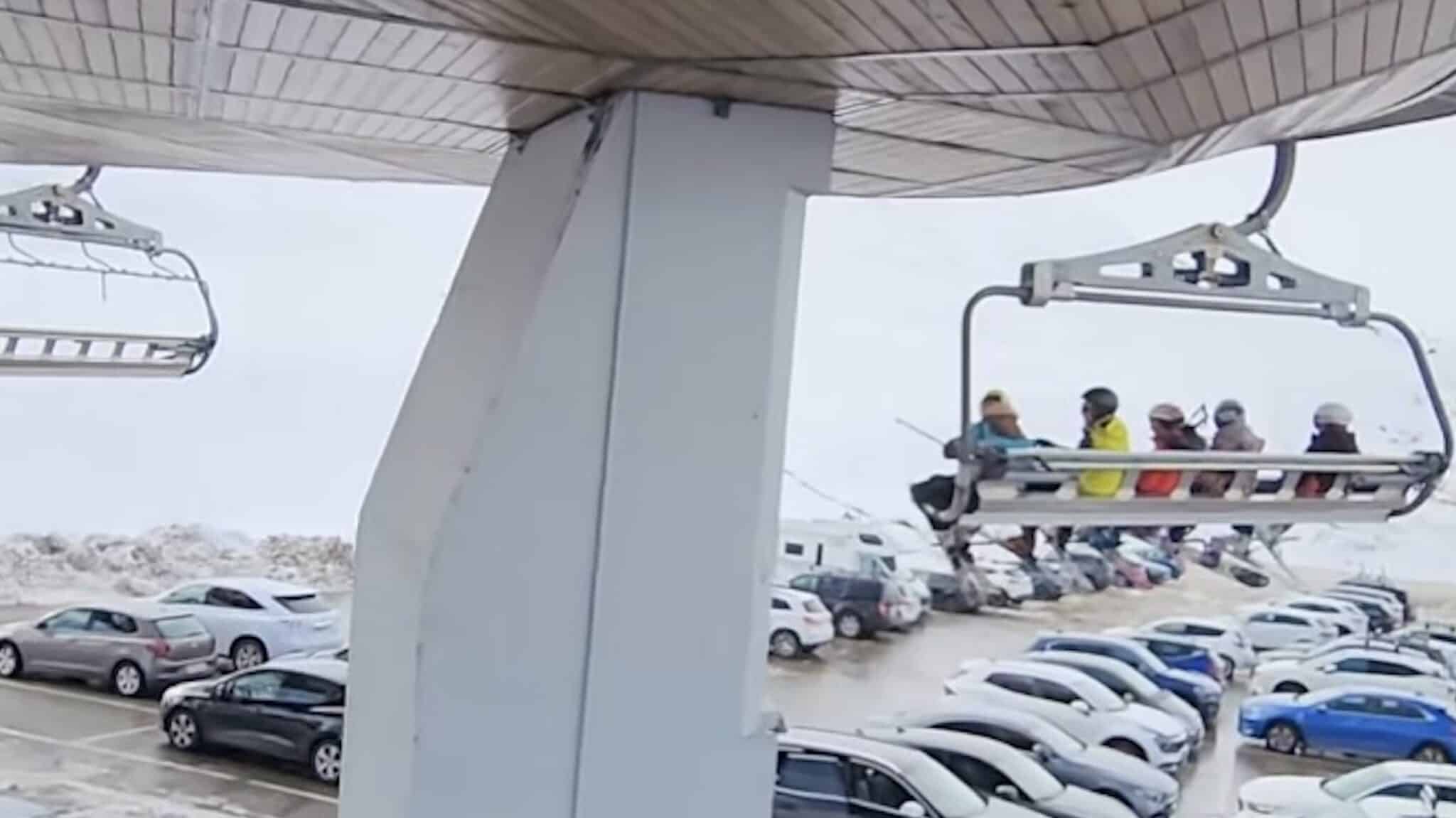 This Unique 8-Person Chairlift Takes A 90 Degree Turn Over A Parking Lot