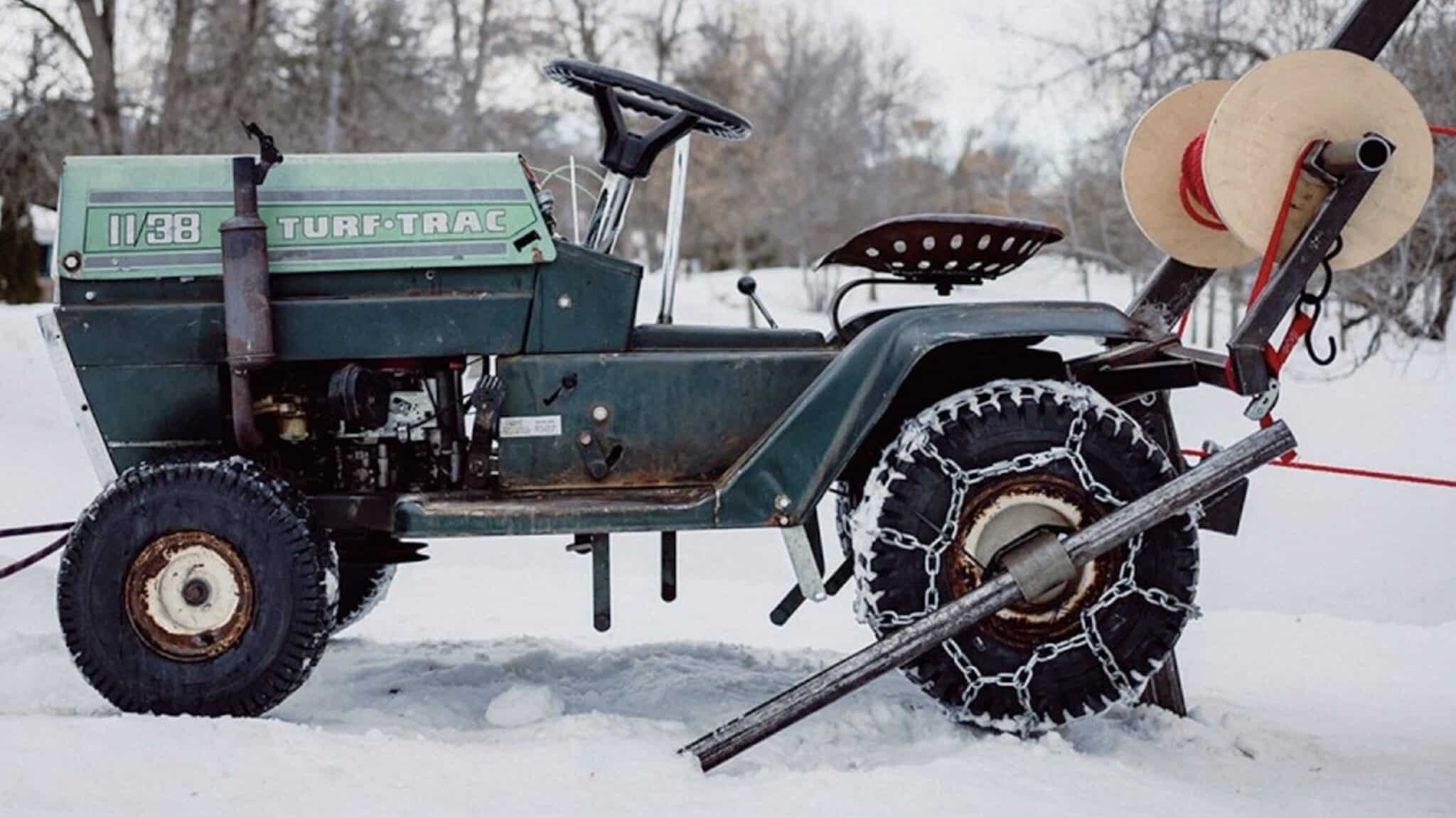 This Backyard Snowboarder Built a DIY Rope Tow Using a Riding Lawn Mower