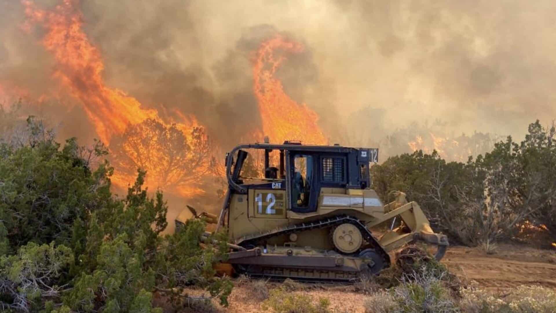 Bulldozers fight wildfires across the United States.