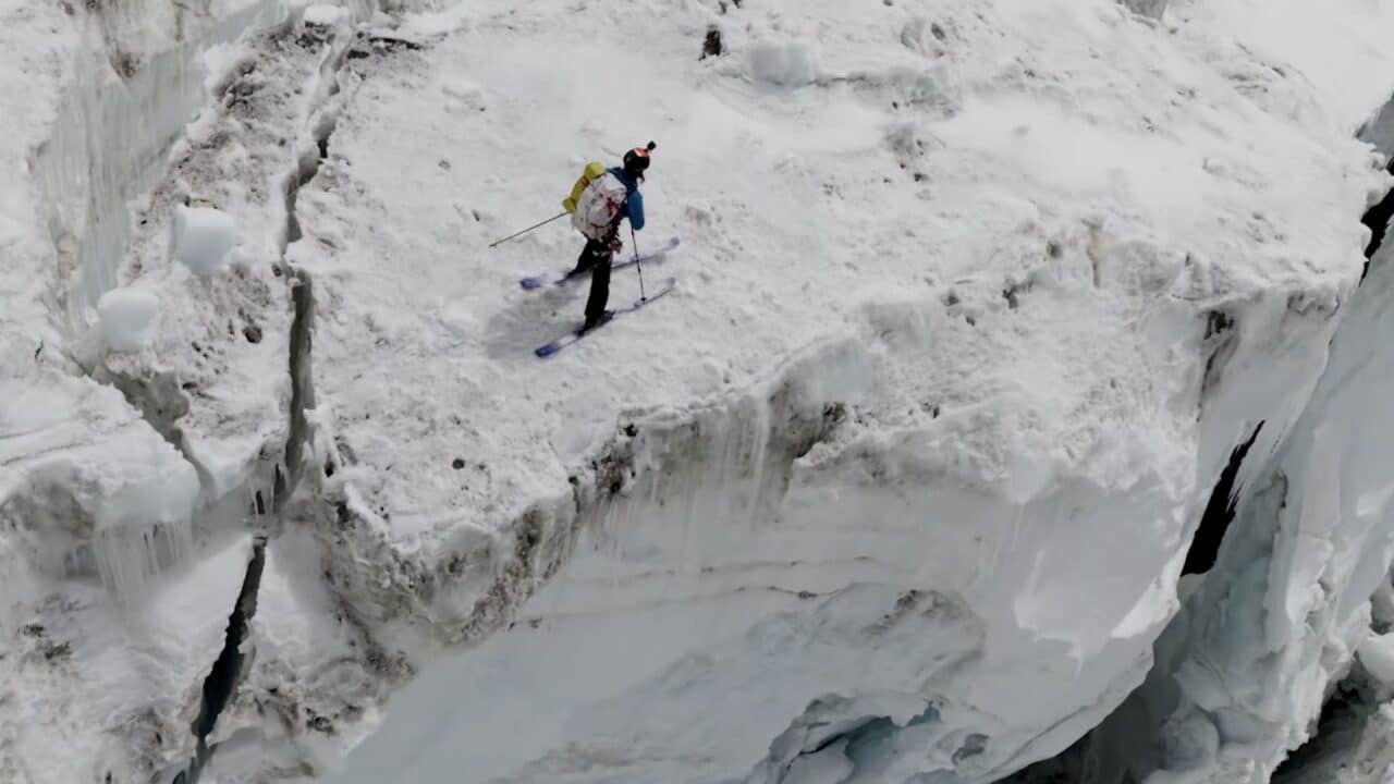 Skiing through the dangerous Khumbu Icefall on Mount Everest.