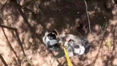Helicopter rescue crew assists an injured mountain biker in California.