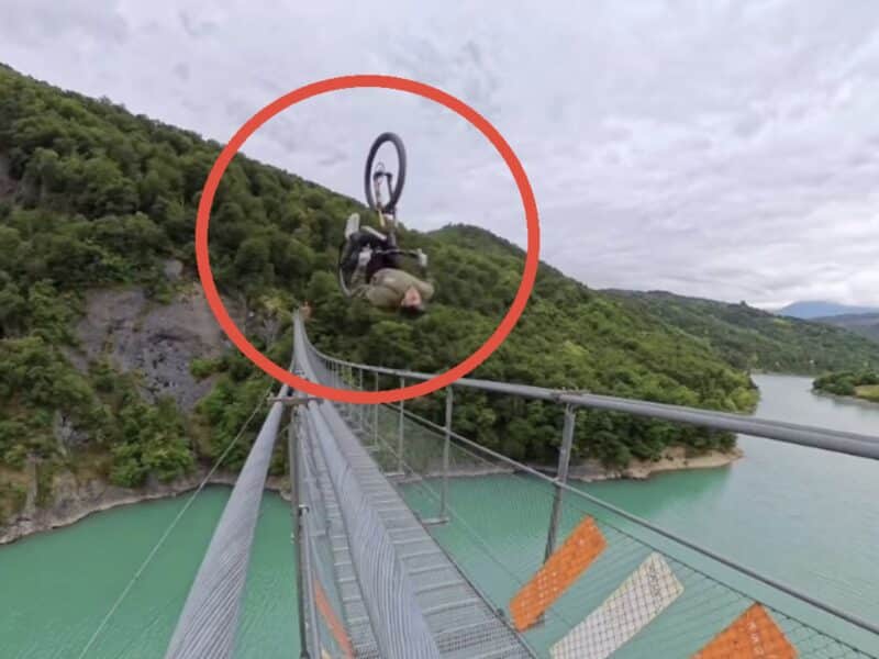Mountain bike backflip down suspension bridge