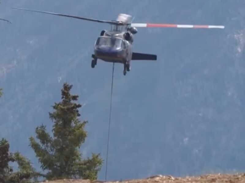 Helicopter crew shuttles equipment for the new Colorado Couloir lift at Purgatory Resort.