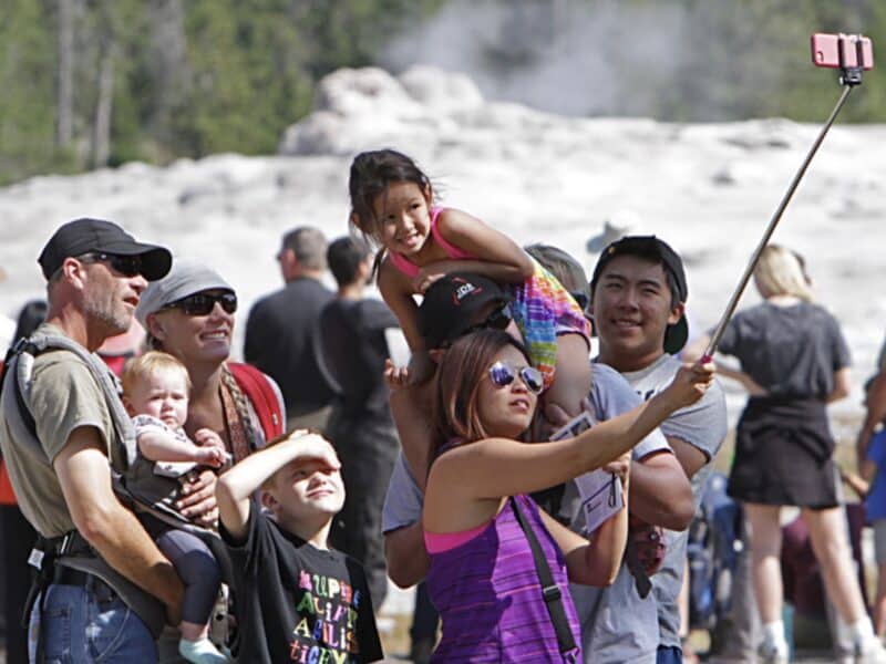Visitors at Old Faithful in Yellowstone National Park.