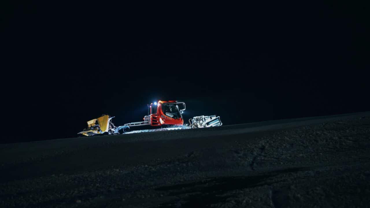Snow grooming at night.