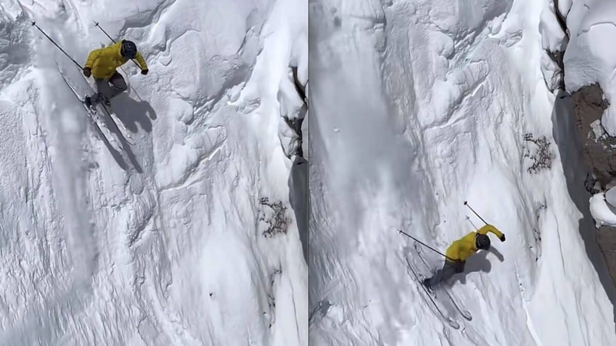 Two skiers in yellow jackets skiing down icy mountain slopes.