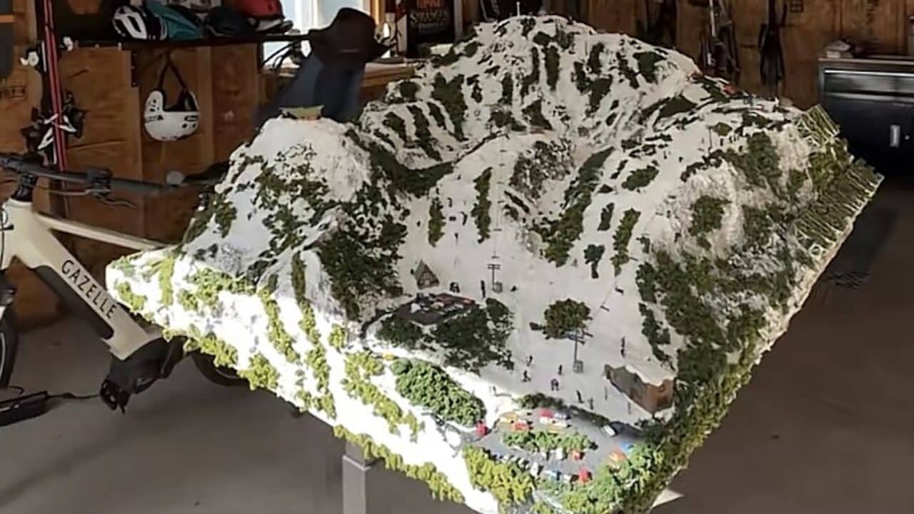 Miniature ski resort built inside of a garage.