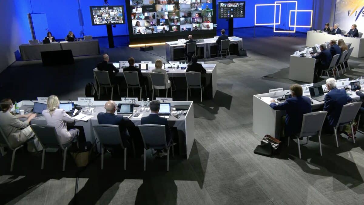 Business conference with participants at a large meeting room.