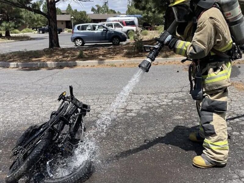 Firefighter extinguishes an e-bike fire in Grand Canyon National Park