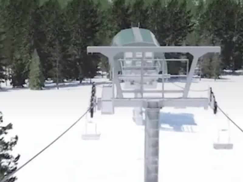 Snow-covered chairlift in a forested mountain area.