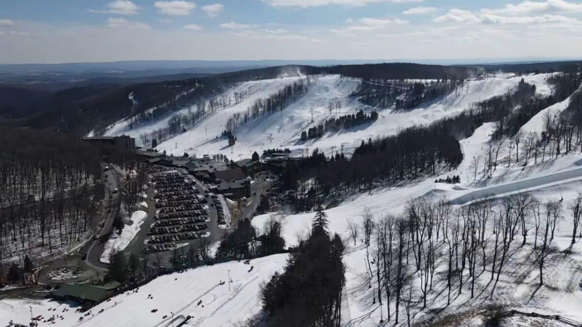 Snow covered slopes and chairlift at Pennsylvania ski resort in winter.