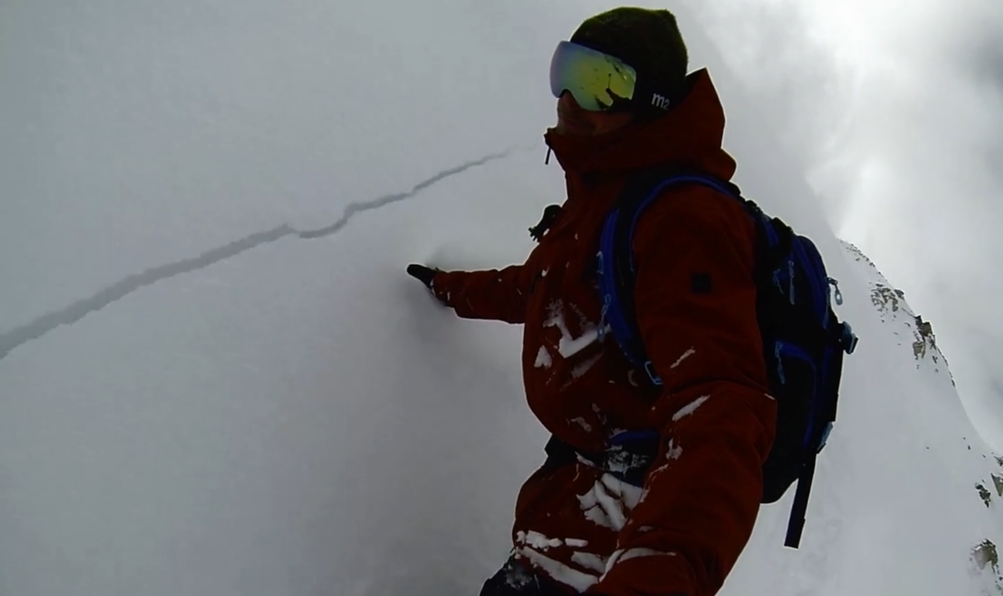 WATCH: Snowboarder Triggers Avalanche While Traversing