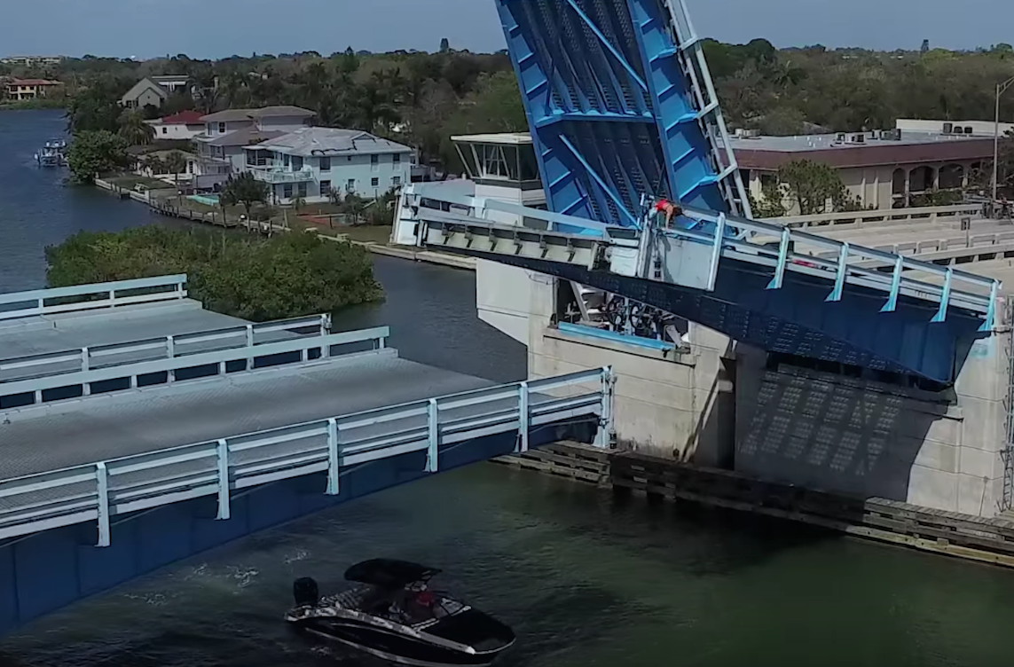 WATCH Kid Jumps Off Draw Bridge Almost Run Over By Boat Propellor
