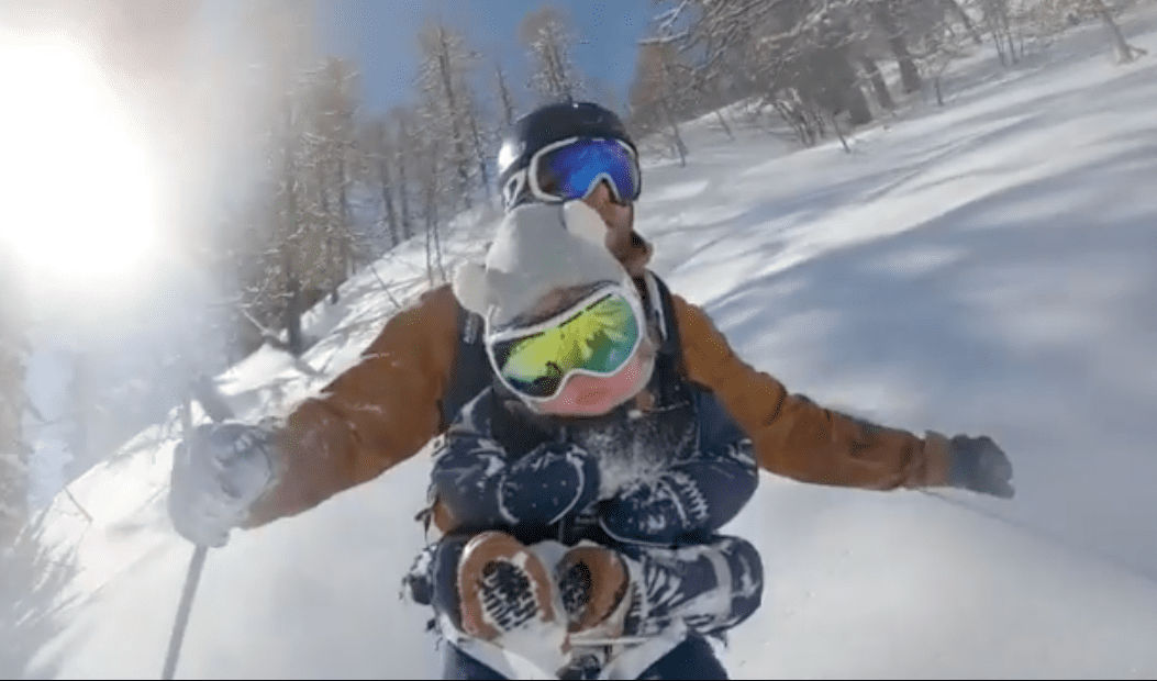 Powder Skiing With A Baby On chest