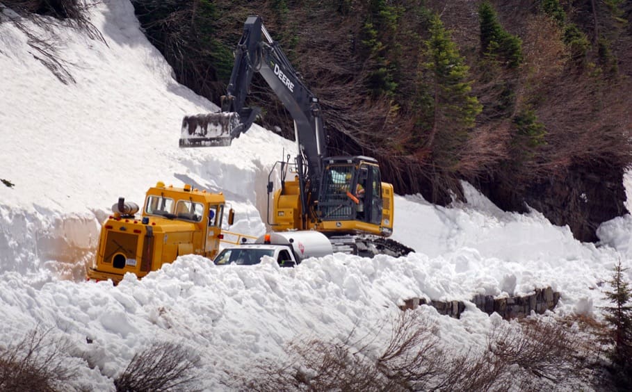 Plow Crews Begin Clearing Snow Drift On Glacier National Park Road 