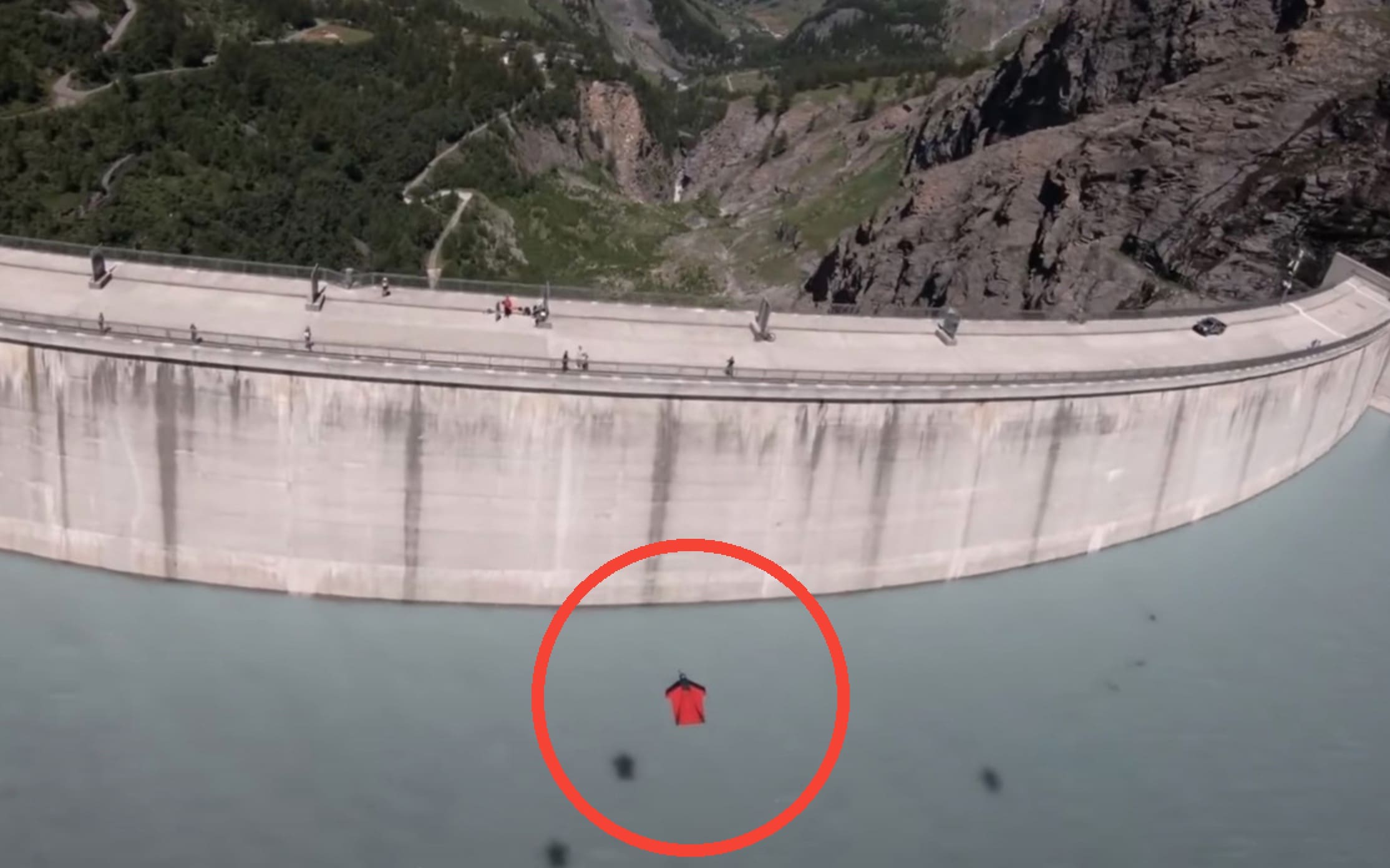 WATCH: Wingsuiter Skims Dam and Narrowly Climbs Over Retaining Wall