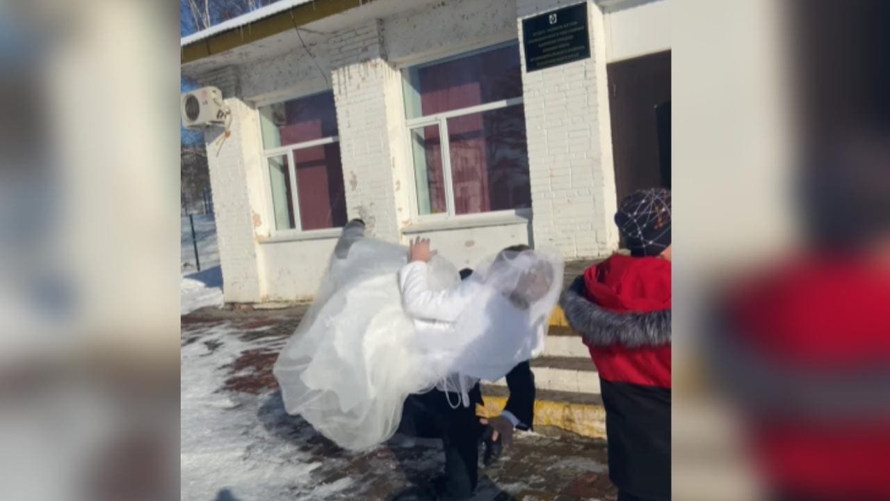Bride & Groom Wipe Out On Slippery Steps