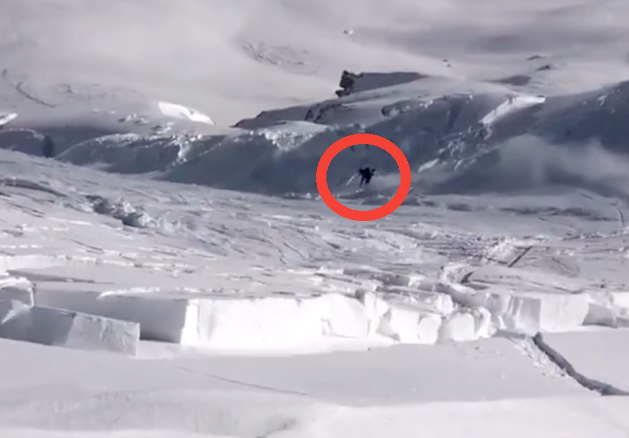 Snowboarder Survives After Triggering Avalanche That Releases Entire Mountainside