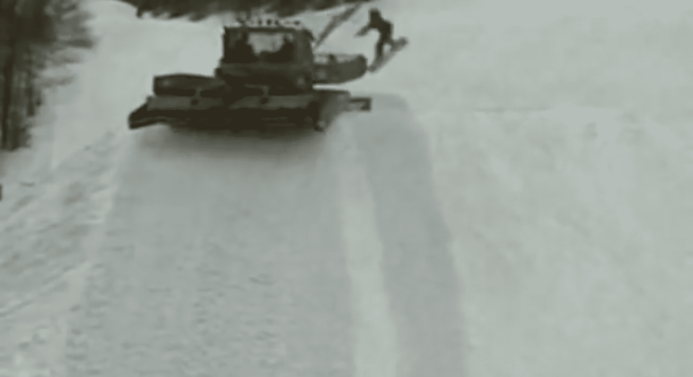 Lucky Snowboarder Nearly Collides With Snowcat Midair (Video)