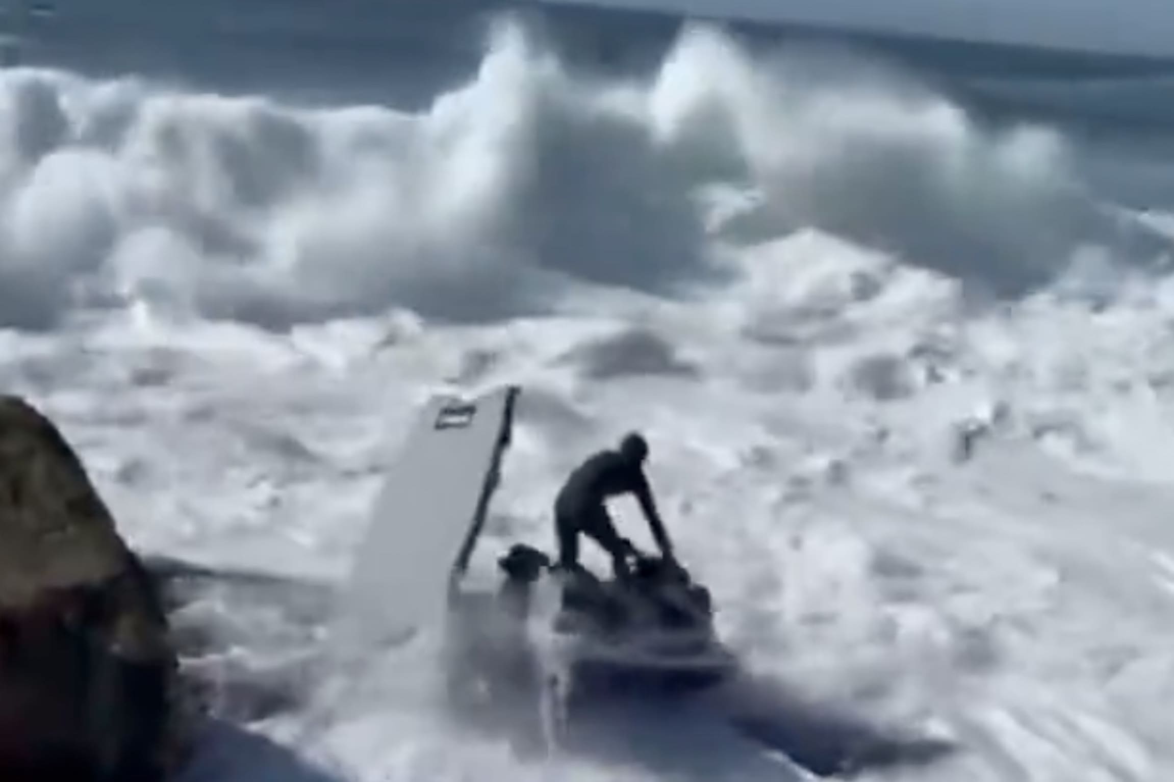 Surfer Abandons Jetski On Rocks Seconds Before Getting Smashed By Wave