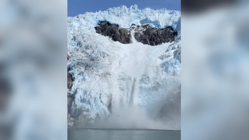 WATCH: Glacial Ice Collapses Into The Sea