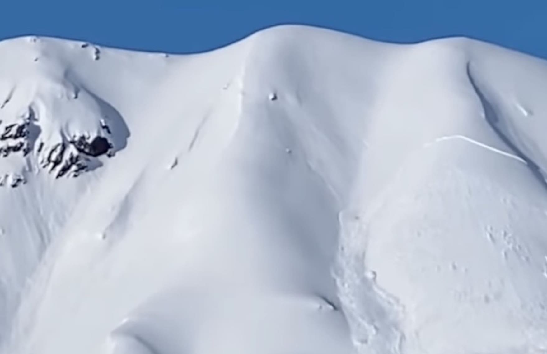 VIDEO: Snowmobiler In Alaska Triggers Massive Avalanche (NSFWL)