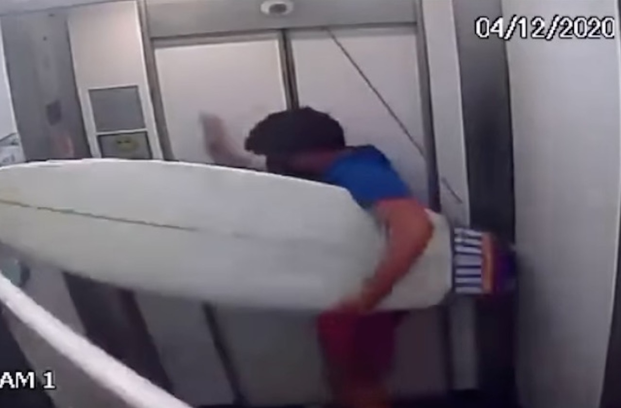 Absent-Minded Surfer Learns Valuable Lesson About Elevators & Leashes